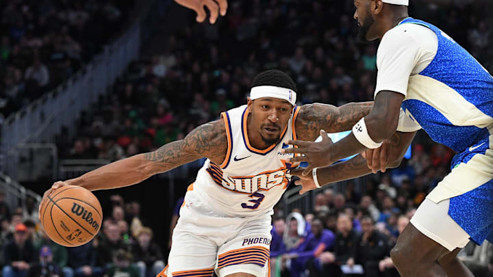 Mar 17, 2024; Milwaukee, Wisconsin, USA; Phoenix Suns guard Bradley Beal (3) drives to the basket against Milwaukee Bucks forward Bobby Portis (9) in the second half at Fiserv Forum. Mandatory Credit: Michael McLoone-Imagn Images