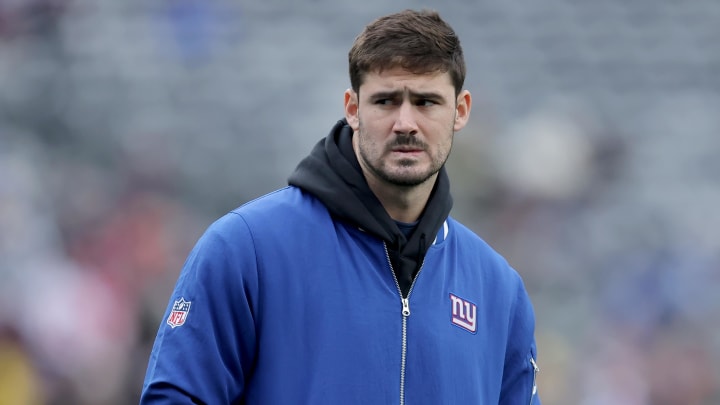 Dec 31, 2023; East Rutherford, New Jersey, USA; New York Giants injured quarterback Daniel Jones (8) watches warmups before a game against the Los Angeles Rams at MetLife Stadium.  