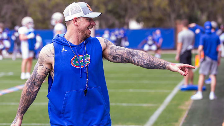 Florida   s Director of Football Strength & Conditioning Tyler Miles, left, wave to possible recruits during practice. The Florida Gators held their second Spring football practice at Sanders Practice Fields in Gainesville, FL on Saturday, March 9, 2024. [Doug Engle/Gainesville Sun]