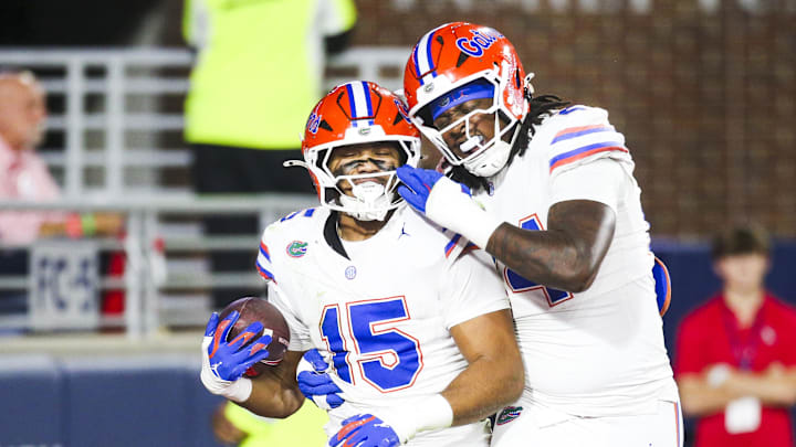 Nov 15, 2025; Oxford, Mississippi, USA; Florida Gators defensive lineman Jayden Woods (15) celebrates with defensive end Kamran James (24) following an interception against the Mississippi Rebels during the first quarter at Vaught-Hemingway Stadium. Mandatory Credit: Petre Thomas-Imagn Images
