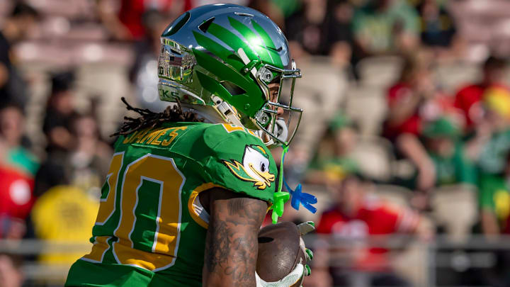 Oregon running back Jordan James carries the ball during warmups as the Oregon Ducks face the Ohio State Buckeyes Wednesday, Jan. 1, 2025, in the quarterfinal of the College Football Playoff at the Rose Bowl in Pasadena, Calif. Oregon running back Jordan James carries the ball during warmups as the Oregon Ducks face the Ohio State Buckeyes Wednesday, Jan. 1, 2025, in the quarterfinal of the College Football Playoff at the Rose Bowl in Pasadena, Calif.