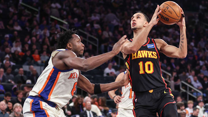 Jan 2, 2026; New York, New York, USA;  Atlanta Hawks forward Zaccharie Risacher (10) looks to drive past New York Knicks forward Og Anunoby (8) in the third quarter at Madison Square Garden. Mandatory Credit: Wendell Cruz-Imagn Images