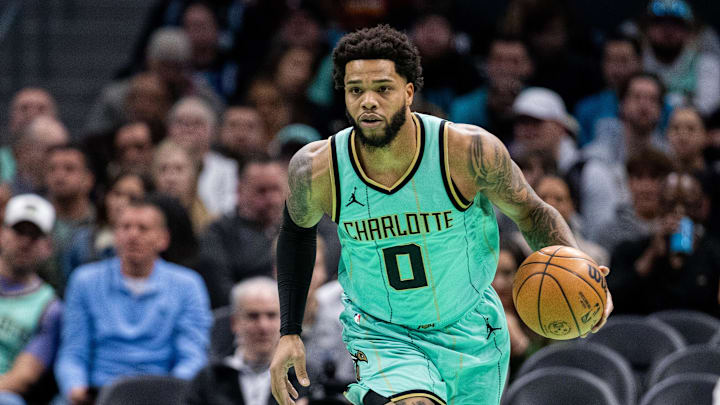 Jan 25, 2025; Charlotte, North Carolina, USA; Charlotte Hornets forward Miles Bridges (0) brings the ball up court against the New Orleans Pelicans during the first quarter at Spectrum Center. Mandatory Credit: Scott Kinser-Imagn Images