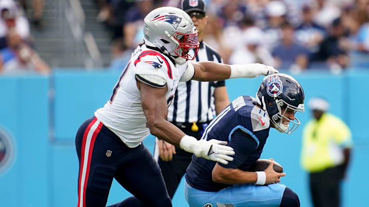 New England Patriots defensive end Deatrich Wise Jr. (91) sacks Tennessee Titans quarterback Mason Rudolph (11) during the first quarter at Nissan Stadium in Nashville, Tenn., Sunday, Nov. 3, 2024.
