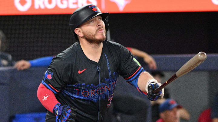Toronto Blue Jays designated hitter Alejandro Kirk (30) hits an RBI single against the Boston Red Sox in the fifth inning at Rogers Centre in 2024. Toronto Blue Jays designated hitter Alejandro Kirk (30) hits an RBI single against the Boston Red Sox in the fifth inning at Rogers Centre in 2024.
