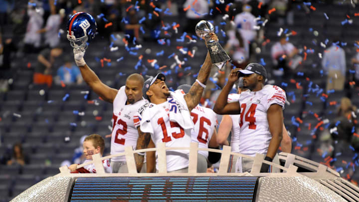 Feb 5, 2012; Indianapolis, IN, USA; New York Giants defensive end Osi Umenyiora (72), receiver Devin Thomas (15) and linebacker Mathias Kiwanuka (94) celebrate with the Vince Lombardi Trophy after Super Bowl XLVI against the New England Patriots at Lucas Oil Stadium. Mandatory Credit: Kirby Lee/Image of Sport-Imagn Images Feb 5, 2012; Indianapolis, IN, USA; New York Giants defensive end Osi Umenyiora (72), receiver Devin Thomas (15) and linebacker Mathias Kiwanuka (94) celebrate with the Vince Lombardi Trophy after Super Bowl XLVI against the New England Patriots at Lucas Oil Stadium. Mandatory Credit: Kirby Lee/Image of Sport-Imagn Images