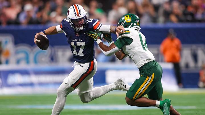 Sep 5, 2026; Atlanta, Georgia, USA; Auburn Tigers quarterback Byrum Brown (17) scrambles past Baylor Bears safety Daniel Cobbs (14) in the fourth quarter at Mercedes-Benz Stadium. Mandatory Credit: Brett Davis-Imagn Images Sep 5, 2026; Atlanta, Georgia, USA; Auburn Tigers quarterback Byrum Brown (17) scrambles past Baylor Bears safety Daniel Cobbs (14) in the fourth quarter at Mercedes-Benz Stadium. Mandatory Credit: Brett Davis-Imagn Images