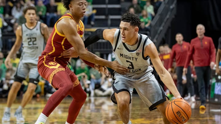 Oregon guard Jackson Shelstad drives the ball up the court as the Oregon Ducks host the USC Trojans.