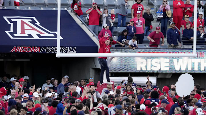 Nov 25, 2022; Tucson, Ariz., U.S.;  Arizona Wildcats fans take to the field after defeating Arizona State Sun Devils in the Territorial Cup rivalry game at Arizona Stadium.

Football Asu Ua Fb Arizona State At Arizona