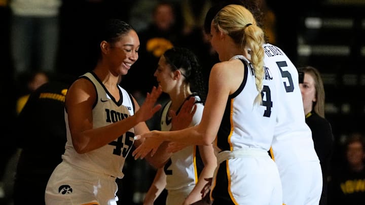 Iowa forward Hannah Stuelke (45) high-fives teammates after being announced in the starting lineup against the Evansville Purple Aces Nov. 9, 2025 during a women’s basketball game at Carver-Hawkeye Arena in Iowa City, Iowa.