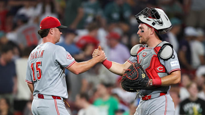 Jul 2, 2025; Boston, Massachusetts, USA; Cincinnati Reds relief pitcher Emilio Pagan (15) and Cincinnati Reds catcher Tyler Stephenson (37) celebrate after defeating the Boston Red Sox at Fenway Park. Mandatory Credit: Paul Rutherford-Imagn Images