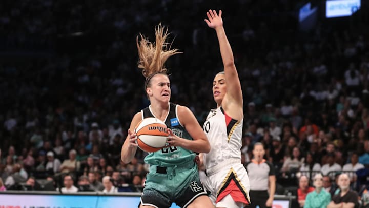 Aug 6, 2023; Brooklyn, New York, USA;  New York Liberty guard Sabrina Ionescu (20) looks to post up against Las Vegas Aces guard Kelsey Plum (10) in the first quarter at Barclays Center. Mandatory Credit: Wendell Cruz-Imagn Images