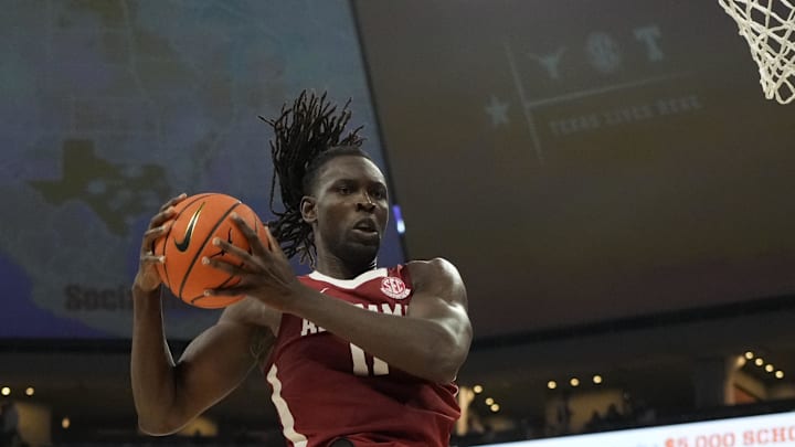 Feb 11, 2025; Austin, Texas, USA; Alabama Crimson Tide guard Clifford Omoruyi (11) grabs a rebound during the second half against the Texas Longhorns at Moody Center. Mandatory Credit: Scott Wachter-Imagn Images