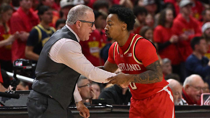 Dec 13, 2025; College Park, Maryland, USA; Maryland Terrapins head coach Buzz Williams and guard David Coit talk during the second half of a game against the Michigan Wolverines at Xfinity Center.