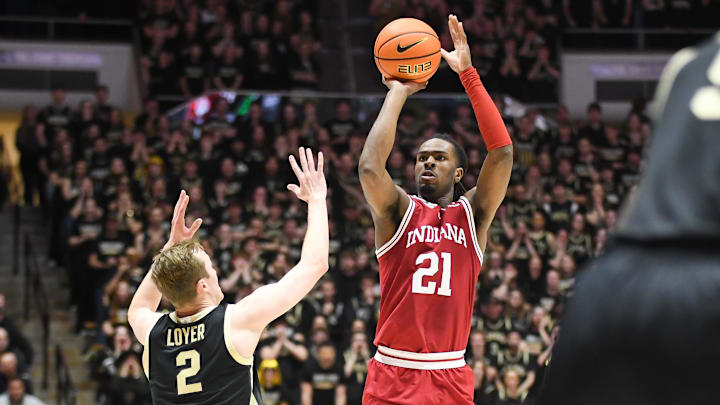 Indiana Hoosiers forward Mackenzie Mgbako (21) makes a three-point basket over Purdue Boilermakers guard Fletcher Loyer (2) during the first half at Mackey Arena. Indiana Hoosiers forward Mackenzie Mgbako (21) makes a three-point basket over Purdue Boilermakers guard Fletcher Loyer (2) during the first half at Mackey Arena.
