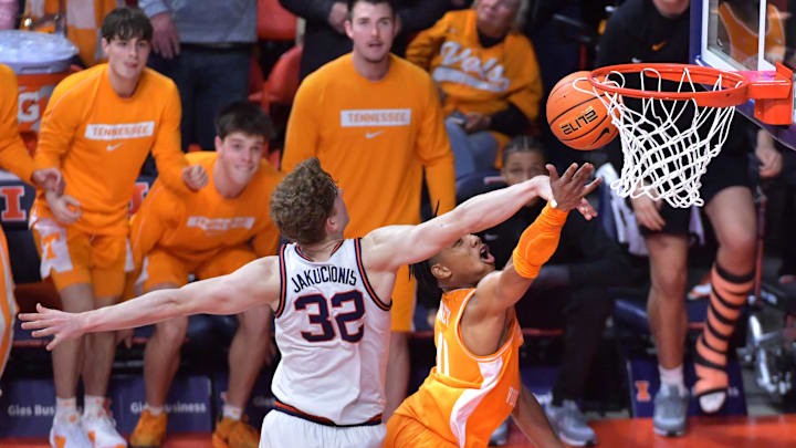 Dec 14, 2024; Champaign, Illinois, USA; Tennessee Volunteers guard Jordan Gainey (11) drives to the basket and scores as Illinois Fighting Illini guard Kasparas Jakucionis (32) defends in the final seconds at State Farm Center. Mandatory Credit: Ron Johnson-Imagn Images Dec 14, 2024; Champaign, Illinois, USA; Tennessee Volunteers guard Jordan Gainey (11) drives to the basket and scores as Illinois Fighting Illini guard Kasparas Jakucionis (32) defends in the final seconds at State Farm Center. Mandatory Credit: Ron Johnson-Imagn Images