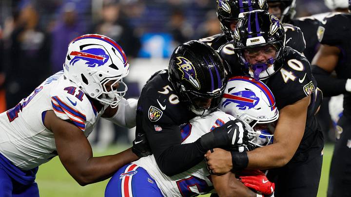 Sep 29, 2024; Baltimore, Maryland, USA; Buffalo Bills running back Ray Davis (22) is tackled by Baltimore Ravens linebacker Adisa Isaac (50) and Ravens linebacker Malik Harrison (40) at M&T Bank Stadium. Mandatory Credit: Geoff Burke-Imagn Images