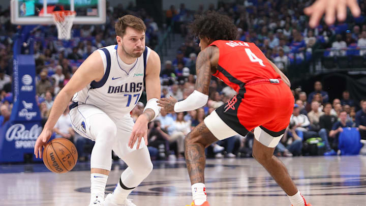 Apr 7, 2024; Dallas, Texas, USA; Dallas Mavericks guard Luka Doncic (77) is guarded by Houston