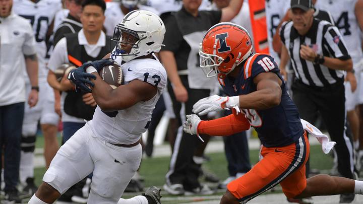 Sep 16, 2023; Champaign, Illinois, USA; Penn State Nittany Lions running back Kaytron Allen (13) runs against Illinois Fighting Illini defensive lineman Mason Muragin (18) during the second half at Memorial Stadium. Mandatory Credit: Ron Johnson-USA TODAY Sports Sep 16, 2023; Champaign, Illinois, USA; Penn State Nittany Lions running back Kaytron Allen (13) runs against Illinois Fighting Illini defensive lineman Mason Muragin (18) during the second half at Memorial Stadium. Mandatory Credit: Ron Johnson-USA TODAY Sports