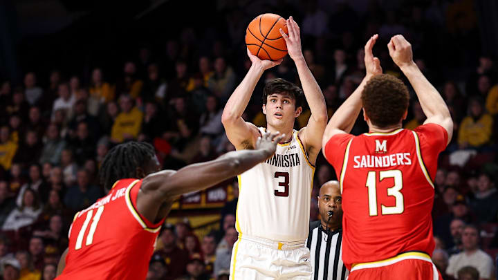 Feb 8, 2026; Minneapolis, Minnesota, USA; Minnesota Golden Gophers forward Bobby Durkin (3) shoots over Maryland Terrapins forward Elijah Saunders (13) and guard George Turkson Jr. (11) during the first half at Williams Arena. Mandatory Credit: Matt Krohn-Imagn Images