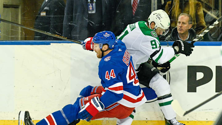 Dec 2, 2025; New York, New York, USA;  New York Rangers defenseman Vladislav Gavrikov (44) falls on the knee of Dallas Stars center Tyler Seguin (91) during the first period at Madison Square Garden. Mandatory Credit: Dennis Schneidler-Imagn Images