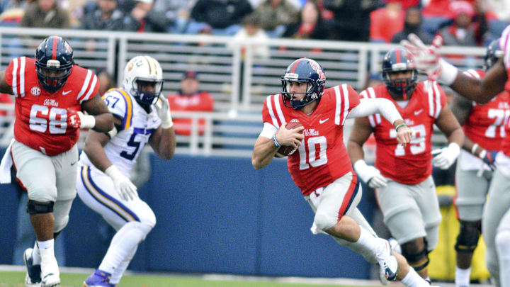 Nov 21, 2015; Oxford, MS, USA; Mississippi Rebels quarterback Chad Kelly (10) runs the ball during the first quarter of the game against the LSU Tigers at Vaught-Hemingway Stadium. Mandatory Credit: Matt Bush-Imagn Images