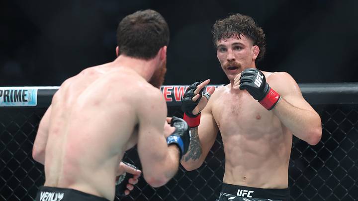 Jun 7, 2025; Newark, New Jersey, UNITED STATES; Quillan Salkilld (red gloves) fights Yanal Ashmouz (blue gloves) during UFC 316 at Prudential Center. Mandatory Credit: Vincent Carchietta-Imagn Images Jun 7, 2025; Newark, New Jersey, UNITED STATES; Quillan Salkilld (red gloves) fights Yanal Ashmouz (blue gloves) during UFC 316 at Prudential Center. Mandatory Credit: Vincent Carchietta-Imagn Images