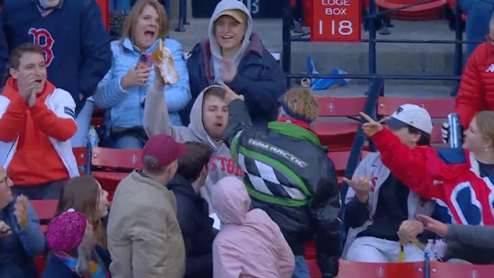 Red Sox fan catches a foul ball in his dessert at Fenway Park