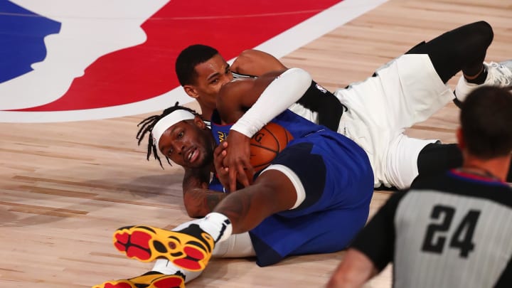 Aug 5, 2020; Lake Buena Vista, Florida, USA;  Denver Nuggets forward Jerami Grant (9) battles San Antonio Spurs guard Dejounte Murray (5) for a loose ball against the San Antonio Spurs during the first half of a NBA basketball game at Visa Athletic Center. Mandatory Credit: Kim Klement-USA TODAY Sports