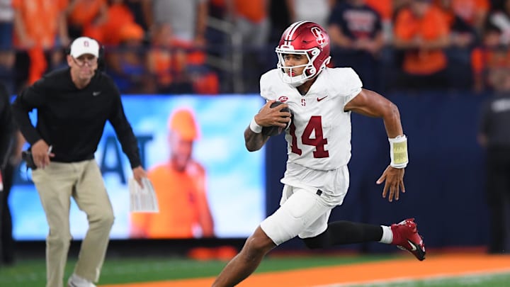 Sep 20, 2024; Syracuse, New York, USA; Stanford Cardinal quarterback Ashton Daniels (14) runs with the ball against the Syracuse Orange during the second half at the JMA Wireless Dome. Mandatory Credit: Rich Barnes-Imagn Images