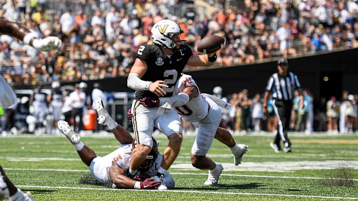 Aug 31, 2024; Vanderbilt quarterback Diego Pavia (2) fumbles the ball after being hit by Virginia Tech linebacker Caleb Woodson (20).