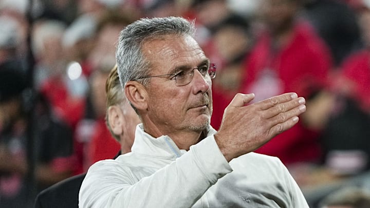 Former Ohio State Buckeyes head coach Urban Meyer salutes the fans chanting his name during the College Football Playoff quarterfinal against the Oregon Ducks at the Rose Bowl in Pasadena, Calif. on Jan. 1, 2025. Ohio State won 41-21.