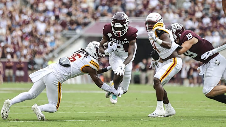 Sep 16, 2023; College Station, Texas, USA; Texas A&M Aggies running back Rueben Owens (2) runs with the ball as Louisiana Monroe Warhawks safety AJ Watts (16) defends during the first quarter at Kyle Field. Mandatory Credit: Troy Taormina-Imagn Images