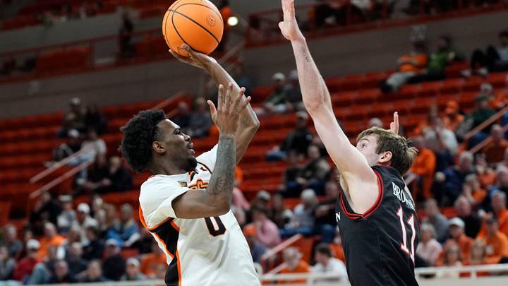 Oklahoma State guard Jaylen Curry (0) shoots over Davidson guard Sam Brown (11) in the first round of the NIT on Tuesday, March 17, 2026.