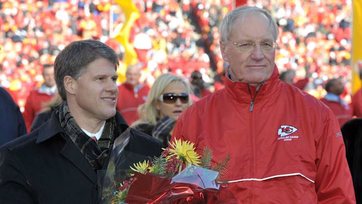 Jan 2, 2011; Kansas City, MO, USA; Kansas City Chiefs former coach Marty Schottenheimer (right) poses with chairman of the board Clark Hunt (left) at halftime ceremony to induct Schottenheimer into the 2010 Chiefs hall of fame during the game against the Oakland Raiders at Arrowhead Stadium.  Mandatory Credit: Kirby Lee/Image of Sport-Imagn Images