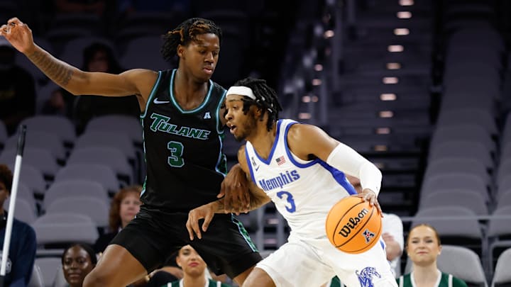 Mar 15, 2025; Fort Worth, TX, USA; Memphis Tigers guard Colby Rogers (3) controls the ball as Tulane Green Wave guard Kam Williams (3) defends during the first half at Dickies Arena. Mandatory Credit: Chris Jones-Imagn Images
