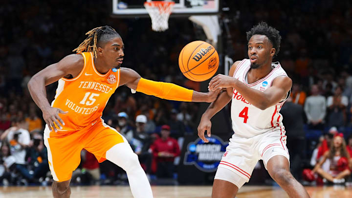 Houston guard L.J. Cryer (4) moves the ball while defended by Tennessee guard Jahmai Mashack (15) in the NCAA Tournament Elite Eight game at Lucas Oil Stadium in Indianapolis.