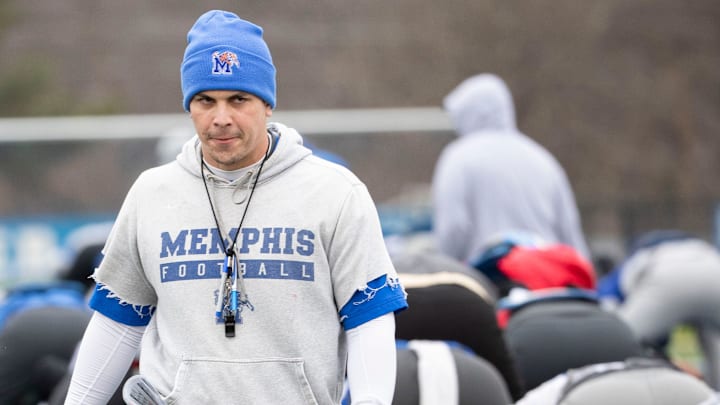 Tony Tokarz walks between rows of players as they warm up Tuesday, Dec. 17, 2019, during a practice at University of Memphis' Billy J Murphy Athletic Complex.