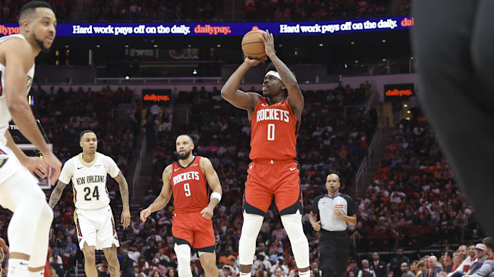 Mar 8, 2025; Houston, Texas, USA;  Houston Rockets guard Aaron Holiday (0) shoots the ball during the third quarter against the New Orleans Pelicans at Toyota Center. Mandatory Credit: Troy Taormina-Imagn Images