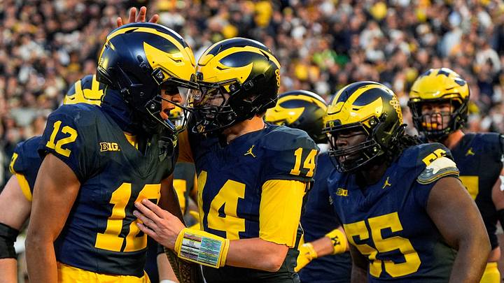 Michigan quarterback Tommy Carr (14) celebrates a touchdown against Penn State with wide receiver Salesi Moa (12) during the second half at Michigan Stadium in Ann Arbor on Saturday, Oct. 17, 2026.