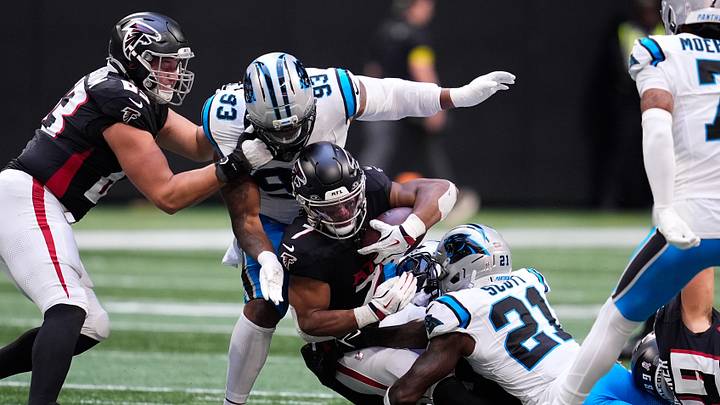 Atlanta Falcons running back Bijan Robinson (7) is brought down by Carolina Panthers safety Nick Scott Atlanta Falcons running back Bijan Robinson (7) is brought down by Carolina Panthers safety Nick Scott