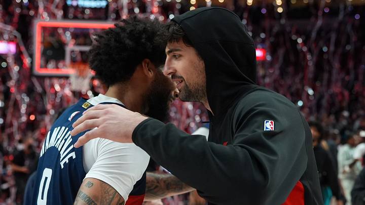 Mar 29, 2026; Portland, Oregon, USA; Washington Wizards forward Justin Champagnie (9) embraces Portland Trail Blazers forward Deni Avdija (8) after the game at Moda Center. Mandatory Credit: Soobum Im-Imagn Images