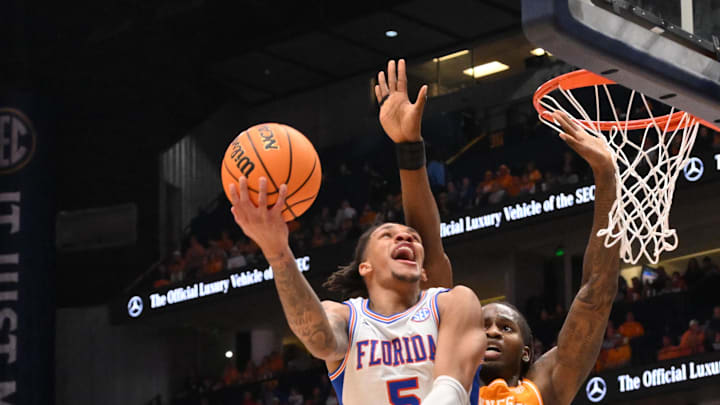 Mar 16, 2025; Nashville, TN, USA; Florida Gators guard Will Richard (5) shoots the ball over Tennessee Volunteers forward Felix Okpara (34) in the first half during the 2025 SEC Championship Game at Bridgestone Arena. Mandatory Credit: Steve Roberts-Imagn Images Mar 16, 2025; Nashville, TN, USA; Florida Gators guard Will Richard (5) shoots the ball over Tennessee Volunteers forward Felix Okpara (34) in the first half during the 2025 SEC Championship Game at Bridgestone Arena. Mandatory Credit: Steve Roberts-Imagn Images