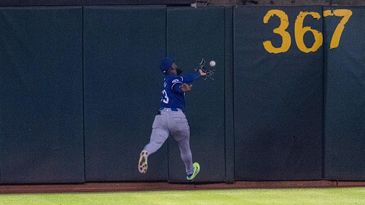 Sep 24, 2024; Oakland, California, USA; Texas Rangers right fielder Adolis García (53) chases down the ball hit by Oakland Athletics first baseman Tyler Soderstrom (not pictured) during the sixth inning at Oakland-Alameda County Coliseum. Mandatory Credit: Neville E. Guard-Imagn Images