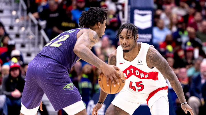 New Orleans Pelicans guard Elfrid Payton (22) dribbles against Toronto Raptors guard Davion Mitchell (45) during the first half at Smoothie King Center. 