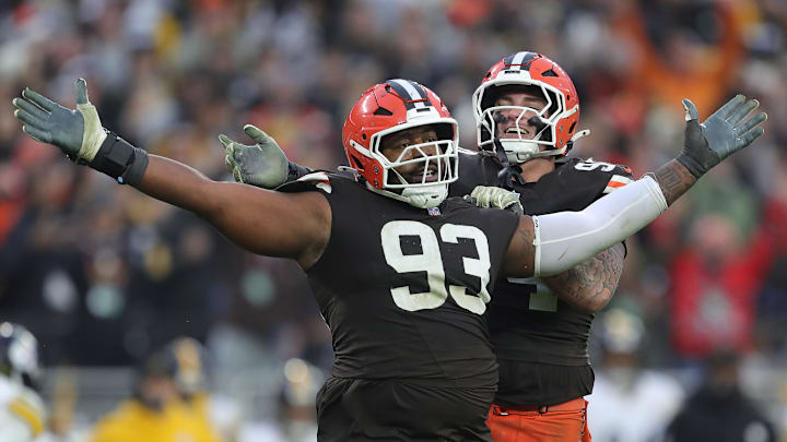 Browns defensive tackle Shelby Harris (93) celebrates with defensive tackle Mason Graham after a second-half stop, Dec. 28, 2025, in Cleveland.
