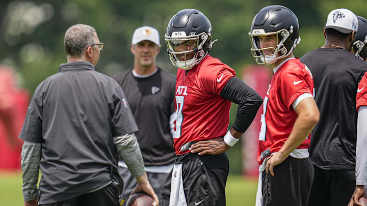 Jun 11, 2025; Atlanta, GA, USA; Atlanta Falcons quarterbacks Michael Penix Jr. (9) and  Kirk Cousins (18)on the field during Minicamp practice at Children's Healthcare of Atlanta Training Ground. Mandatory Credit: Dale Zanine-Imagn Images