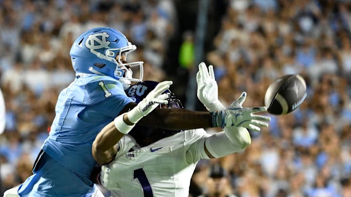 Sep 1, 2025; Chapel Hill, North Carolina, USA; TCU Horned Frogs safety Austin Jordan (1) breaks up a pass intended for North Carolina Tar Heels wide receiver Jordan Shipp (1) in the second quarter at Kenan Stadium. Mandatory Credit: Bob Donnan-Imagn Images