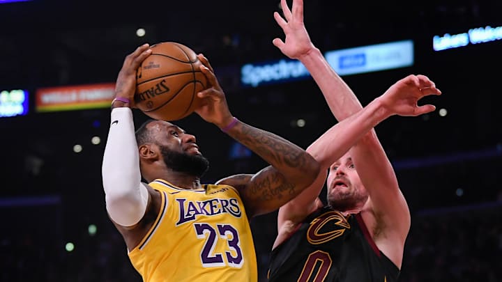 Jan 13, 2020; Los Angeles, California, USA; Los Angeles Lakers forward LeBron James (23) drives to the basket on Cleveland Cavaliers forward Kevin Love (0)during the second quarter at Staples Center. Mandatory Credit: Robert Hanashiro-Imagn Images Jan 13, 2020; Los Angeles, California, USA; Los Angeles Lakers forward LeBron James (23) drives to the basket on Cleveland Cavaliers forward Kevin Love (0)during the second quarter at Staples Center. Mandatory Credit: Robert Hanashiro-Imagn Images