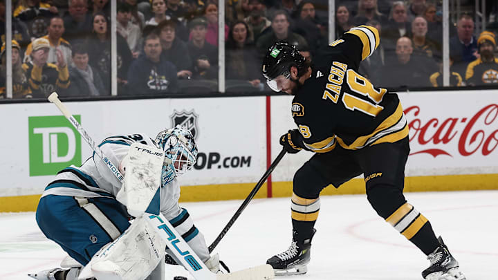 Mar 12, 2026; Boston, Massachusetts, USA; Boston Bruins center Pavel Zacha (18) tries to get to a rebound in front of San Jose Sharks goaltender Alex Nedeljkovic (33) during the second period at TD Garden. Mandatory Credit: Winslow Townson-Imagn Images
